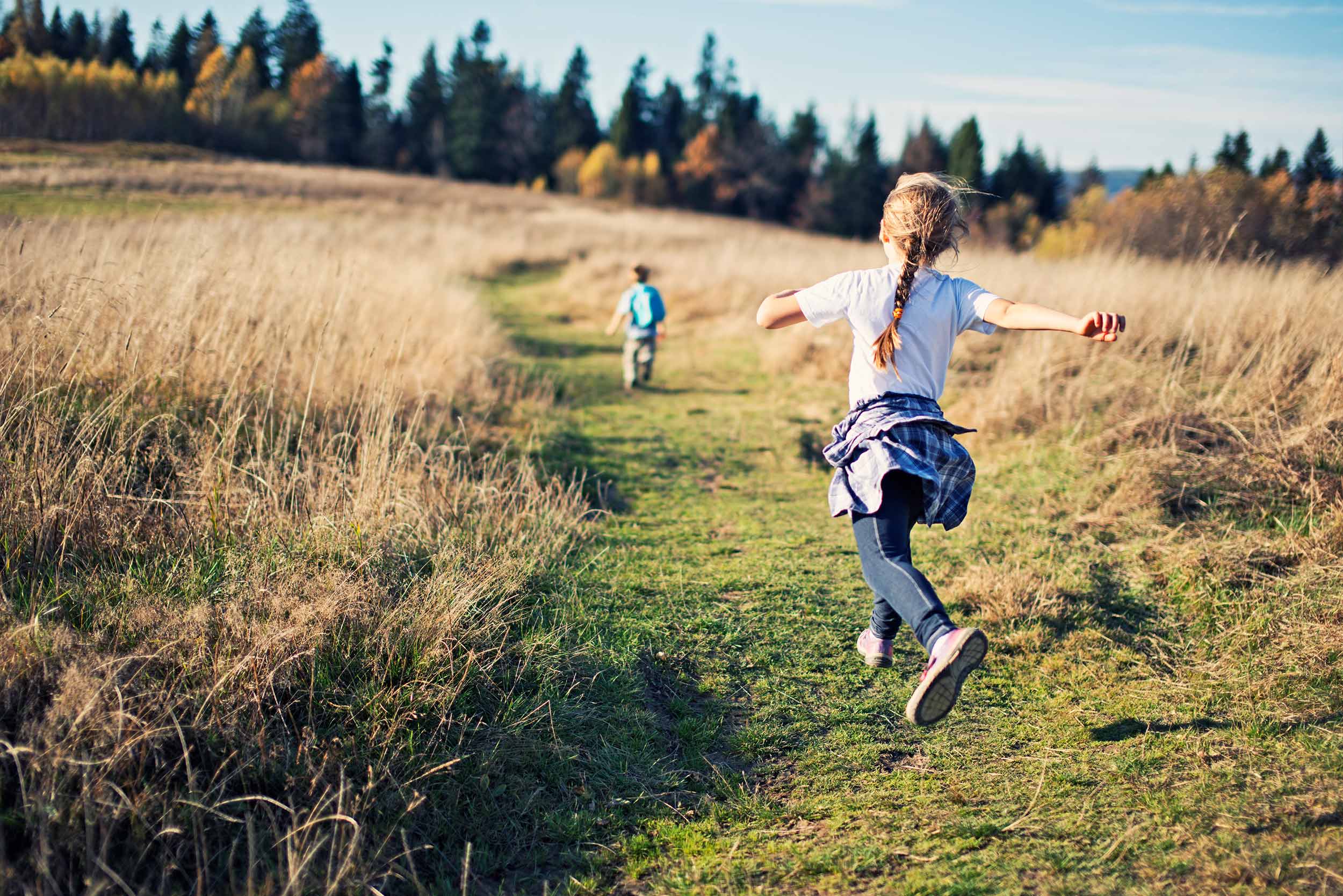 Kids running in the countryside
